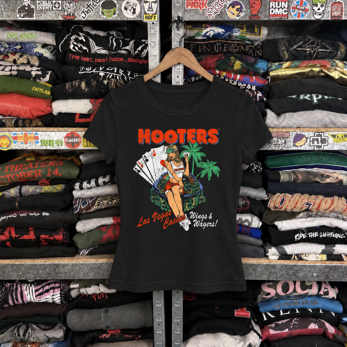 Y2K Hooter 'Wings And Wagers' Las Vegas Rare Womens Black Tee — off-body front on wooden hanger