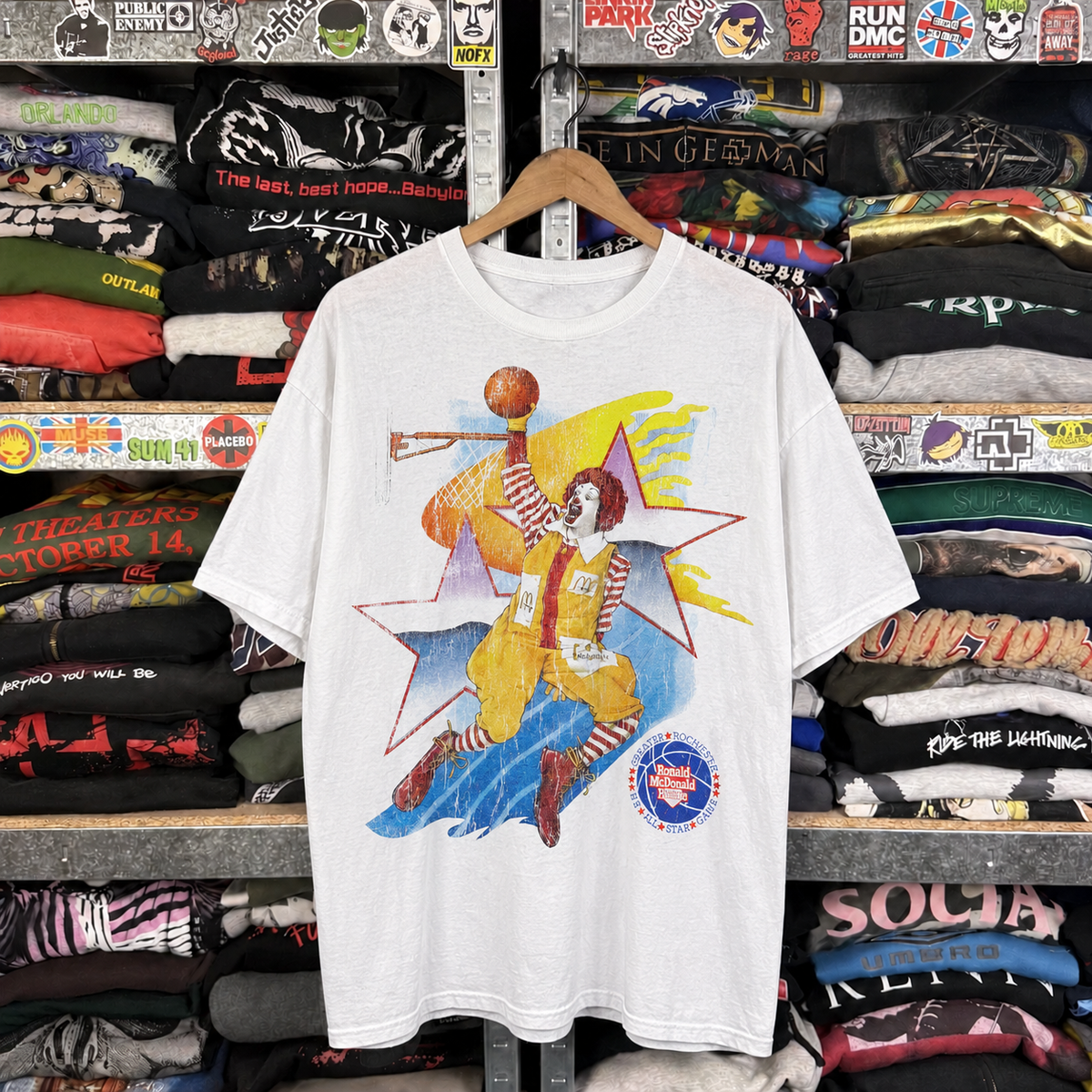 90's All Star Ronald - Rmh - Vintage Washed White T-Shirt — off-body front on wooden hanger