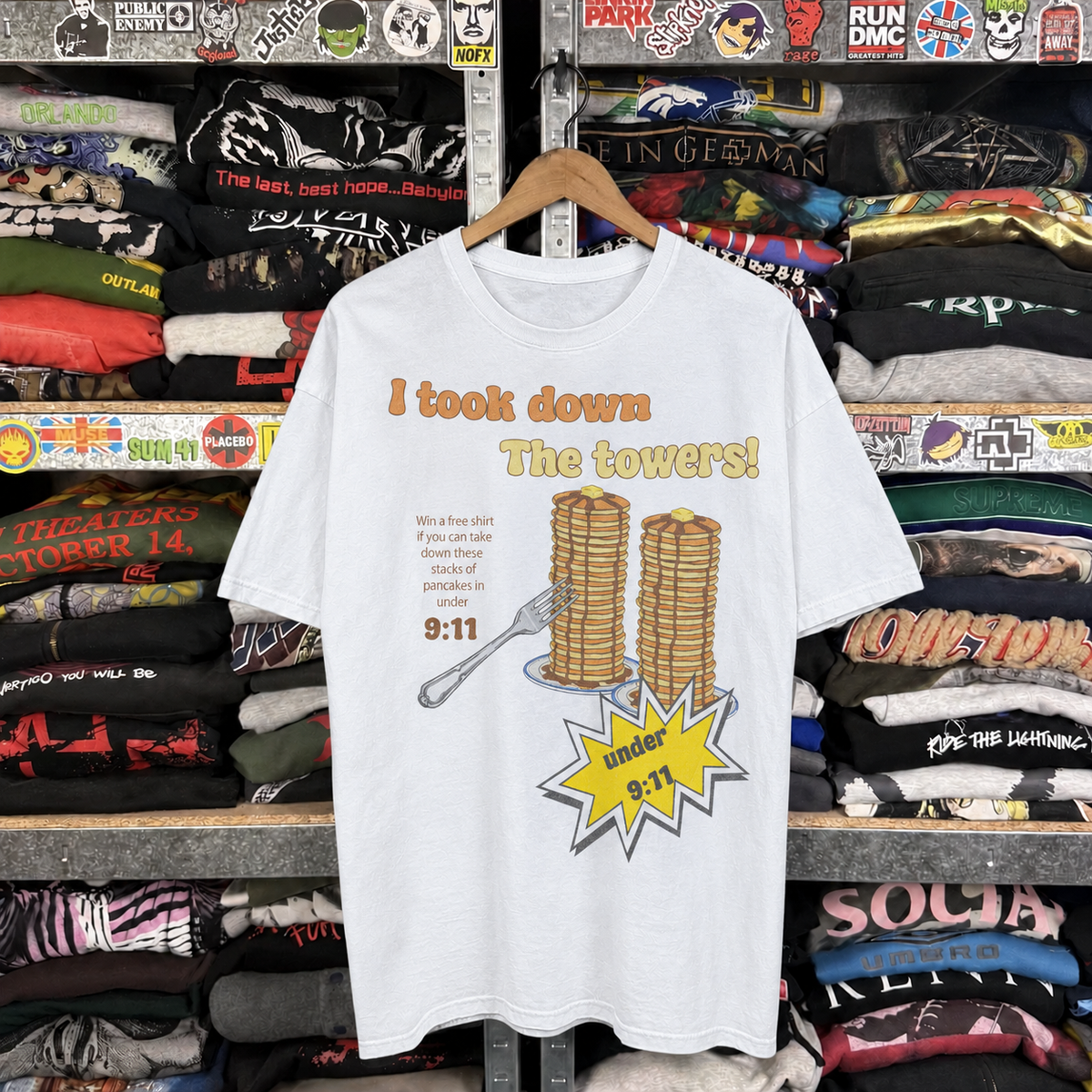 9:11 'I Took Down the Towers!' Pancake Challenge Vintage Washed White Tee — off-body front on wooden hanger